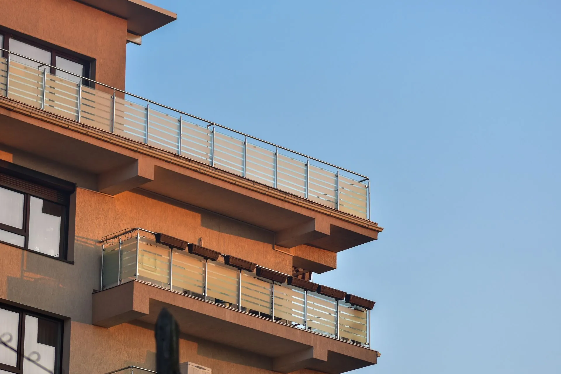 Glass balcony guardrails on a modern residential building in Vancouver BC