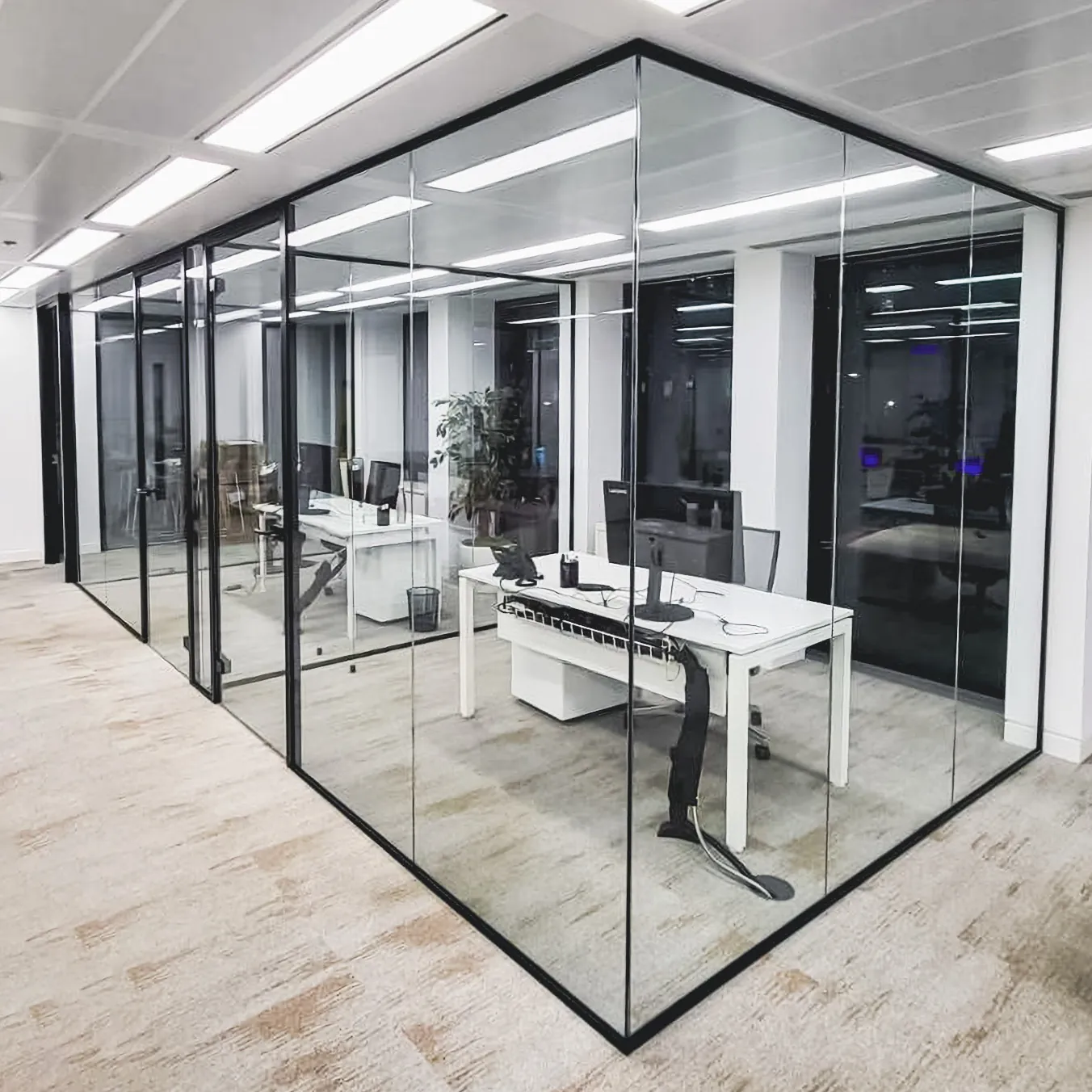 Black-framed glass office partitions in a Vancouver office