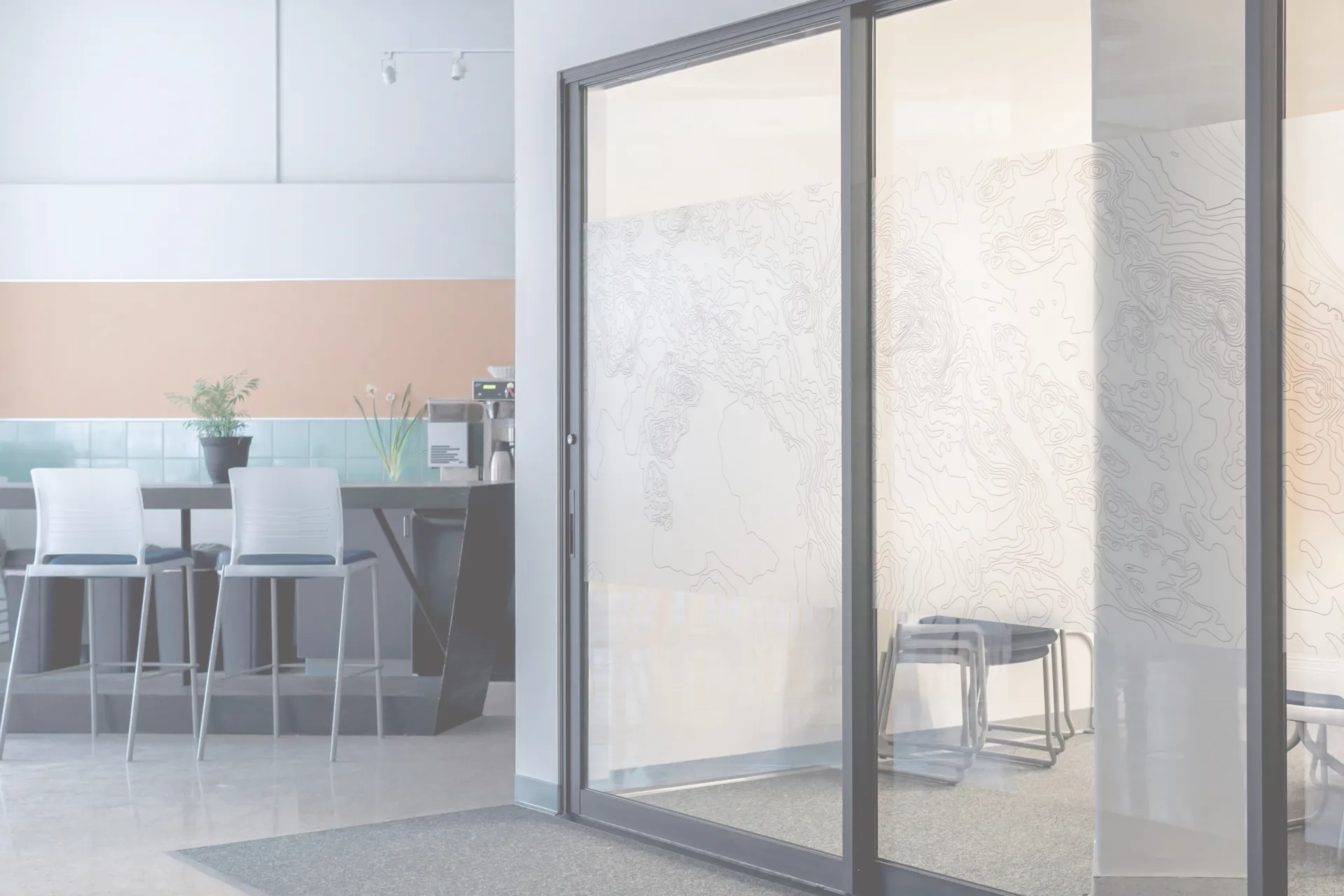 Interior frosted glass partition in a modern kitchen and dining area