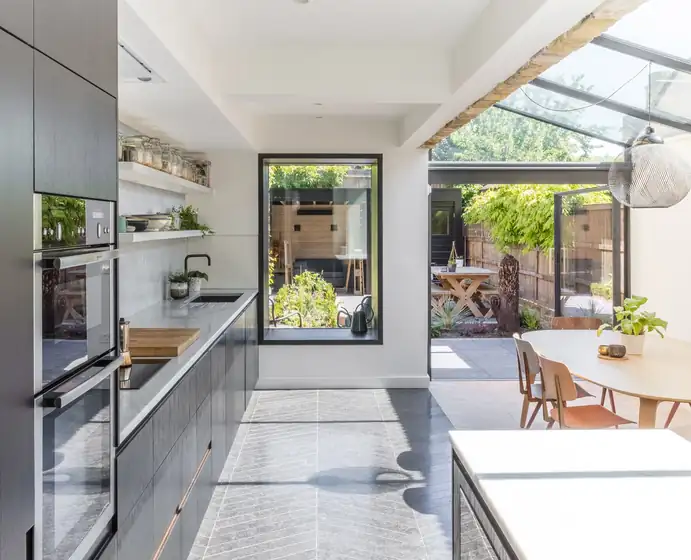 Kitchen glass extension with skylight and garden doors