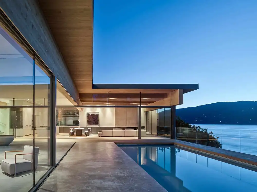 Waterfront pool house with floor-to-ceiling glazing by Evolution Glazing