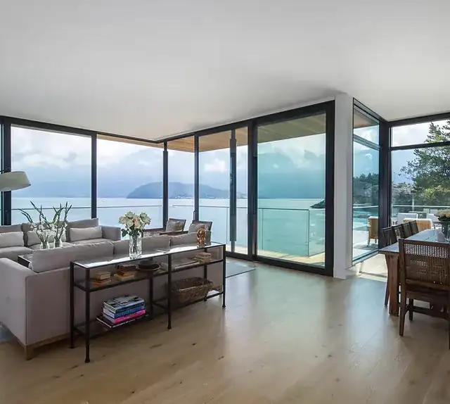 Floor-to-ceiling window wall with ocean view in a West Vancouver home